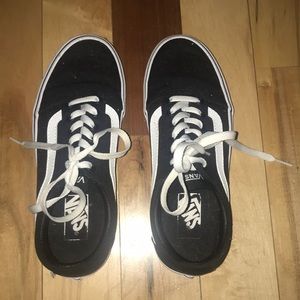 Black and white low top vans